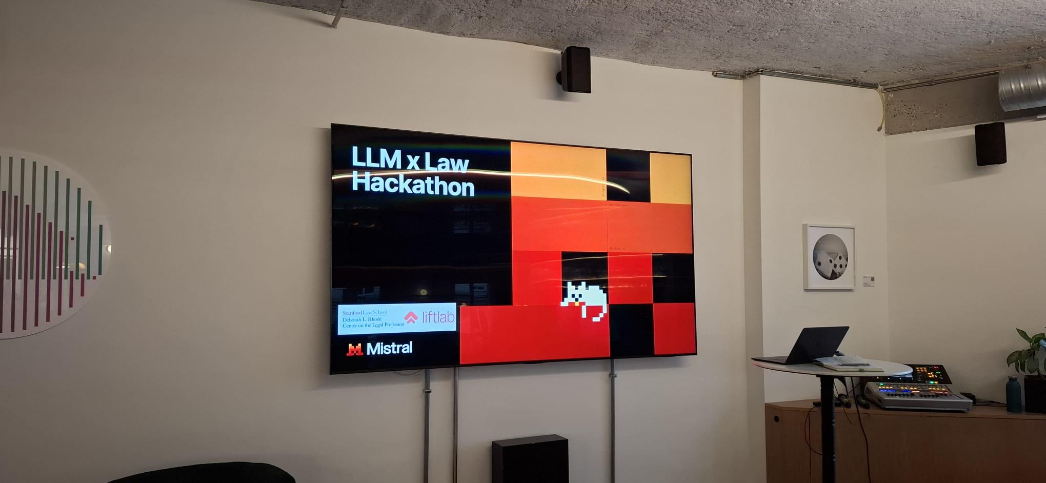Presentation screen at the LLM x Law Hackathon, displaying the event title and Mistral AI branding